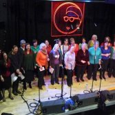 Blurred photo of choir dancing during a performance March 2010